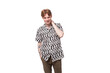 © Ivan Traimak - young confident stylish european man with golden hair is dressed in a black and white shirt with a pattern on a white background