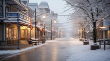 A Tranquil Snow-covered Street Lined With Shops And Illuminated By Warm Streetlights, Evoking A Peaceful Winter Evening.