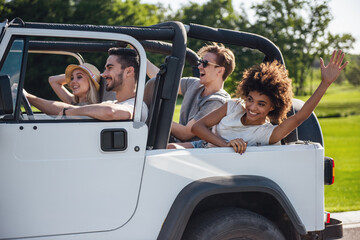 Wall Mural - Friends travelling by car