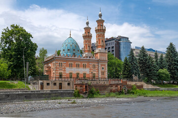 Wall Mural - The ancient Mukhtarov mosque (Sunite mosque) in the city landscape on a June day, Vladikavkaz