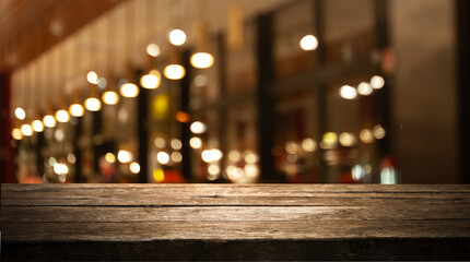 Poster - Wooden table top on blurred cafe showcase with light bulb. Background for product display montage or key visual design, abstraction