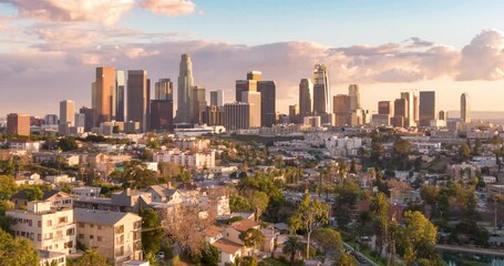 Wall Mural - Aerial time lapse or hyperlapse over Echo Park of downtown Los Angeles, California skyline and skyscrapers from above on a sunny day at golden hour before sunset.