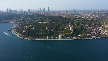 Wall Mural - Aerial shot of Bosphorus, bridge connecting two continents Anatolian Fortress and passing large and small ships and blue sky