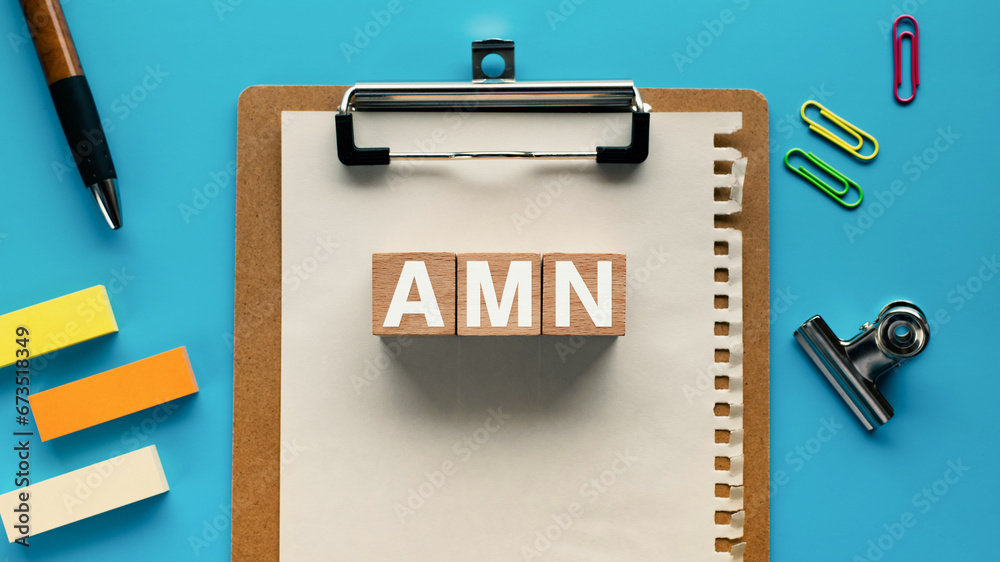 There is wood cube with the word AMN. It is an abbreviation for ...