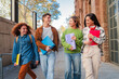 © Jose Calsina - Group of smiling high school teenage students walking before starting class, laughing and talking together. Diverse classmates carrying notebooks and backpacks going along university. Academy people