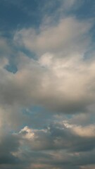 Wall Mural - Quality vertical 4k time lapse of a clouds and blue sky before sunset, no birds, na flicker