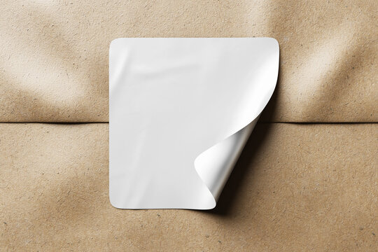 peeled and crumpled rounded square sticker label tag glued on kraft cardboard brown packaging paper realistic mockup 3d rendering illustration