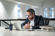 © Volodymyr - Serious Business man entrepreneur startup owner in modern office. Occupation person in work space. Business portrait. Serious business worker. Business, finance and employment. Serious office worker.