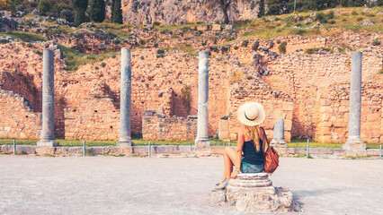 Wall Mural - Woman tourist visiting famous touristic site of Delphi in Greece