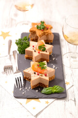 Wall Mural - festive luxury canape with foie gras, wine glasses on christmas celebration table