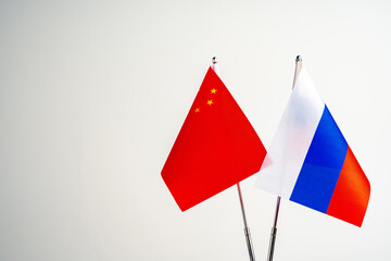 Wall Mural - Russian and Chinese flags on negotiation table