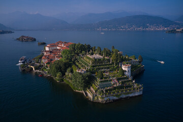 Wall Mural - Aerial panoramic view of Isola Bella drone panoramic view. Borromean Islands, Lake Maggiore, Piedmont, Europe. Panorama at sunset on Lake Maggiore top view. Lake Maggiore, island, Isola Bella, Italy.