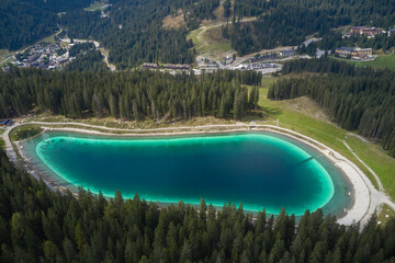 Canvas Print - Montagnoli Lake. Aerial view of Trentino Montagnoli lake. Perspective aerial view of the Montagnoli lake in Trentino.  Blue lake in the Alps. Alpine lake in the mountains, top view.