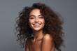 © arhendrix - Portrait of woman, skincare and beauty cosmetics for shine, wellness or healthy glow on studio background. Happy model with curly beautiful hair smiling on gray background.