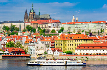 Canvas Print - Lesser town (Mala Strana) cityscape with Prague Castle and cruise boat on Vltava river, Czech Republic