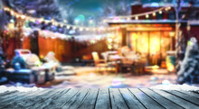 Wooden Table And Winter Party In Backyard Garden With Grill BBQ, Blurred Background