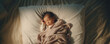 © IBEX.Media - Infant sleeping on bed in wide shot  banner