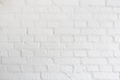 Photograph of a white painted brick wall. perfect for entering text and images