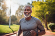 © Igor - Black man running in nature for health, wellness and fitness. Happy senior athlete training, doing exercise and workout, cardio and jogging outdoors at park.