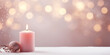 © PEPPERPOT - Pink Christmas - Banner Of Light Up Candle, Ornaments And Branches On Snowy Wooden Table With Pink and Gold Bokeh Background