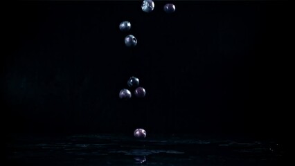 Wall Mural - Blueberries fall on a black table. Filmed on a high-speed camera at 1000 fps. High quality FullHD footage