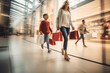 © VicPhoto - Personas de compras en un centro comercial con bolsas.