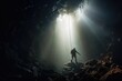 A man explore a deep cave with light ray from above. Outdoor adventure concept.