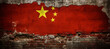 The concept of the Chinese economic crisis and recession tied to the real estate market crisis, with the China flag on a crumbling wall.