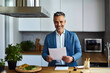 © Hill Tract Zone - Cheerful Male Financial Adviser Working from Home Kitchen