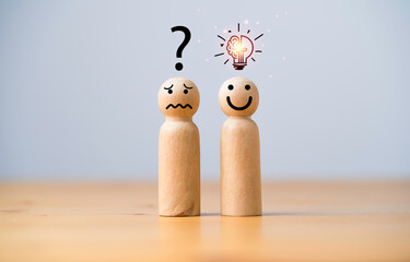 Fototapete - Smile wooden figure with glowing lightbulb and sad wooden figure with question mark for creative thinking idea can solving solution and innovation concept.