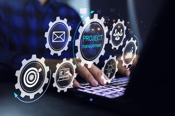 Project management concept with manager working on laptop screen to processing cog workflow to manage task on development process including budget control of available resources for maximum efficiency