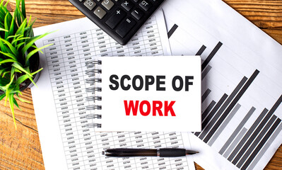 Poster - SCOPE OF WORK text on a notebook with chart and calculator