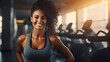 African American woman  fitness trainer smiling and looking at the camera on the background of the gym. The concept of a healthy lifestyle and sports. mock up top greey top sportswear