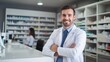 © Oulaphone - Portrait of male pharmacist standing on counter at modern drugstore.