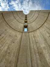 Low Angle Of Voortrekker Monument Against Cloudy Blue Sky In Pretoria, South Africa