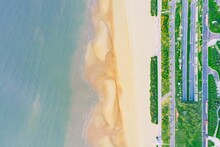 Aerial View Of A Coastal Beach And Urban Roads In Xiamen, Fujian Province, China, Asia