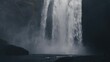 Awe-inspiring Skogafoss waterfall. Icelandic natural wonder with majestic waterfall and rugged surroundings. Suggestive 4k cinematic footage in slow motion. Cold water, cloudy sky, Nordic atmosphere.