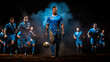 © StasySin - a soccer player in a blue sports uniform is kicking the ball with dark blue background with blue smoke