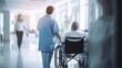 © ETAJOE - Medical person take care patients on Wheelchair at hospital corridor