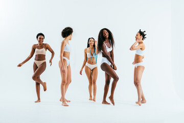 Wall Mural - Beauty portrait of beautiful black women wearing lingerie underwear - Pretty african young women posing in studio, concepts about beauty, cosmetology and diversity