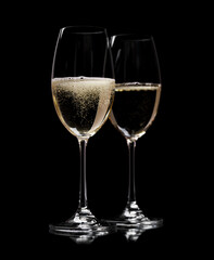 Wall Mural - Two champagne glasses on a black