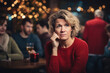 Upset middle aged woman sit alone in bar cafe party, feeling lonely or offended, sad woman got bad news, loner avoid talking to people, outsider suffer from discrimination, lacking friends or company