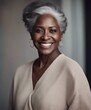 Dark skin woman with smooth healthy face skin. Beautiful aging mature woman with long gray hair 