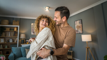 happy couple adult caucasian man woman husband and wife dance at home