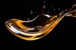 Macro shot of an isolated oil drop being poured on a black background