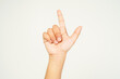© Aria Armoko - child hand pointing with two fingers, hand showing peace sign isolated on white background