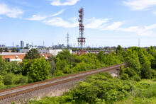 Railroad Tracks - Greenery - Industrial Area - Tower - Blue Sky
