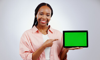 Canvas Print - Woman, presentation and tablet green screen for e learning, online education or promotion on white background. Portrait, African student and digital technology, study opportunity or website in studio