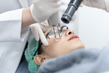 Wall Mural - Woman receiving pico laser facial treatment in beauty Clinic.