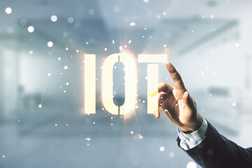 Poster - Man hand working with abstract virtual IOT hologram on blurred office background, internet of things concept. Multiexposure
